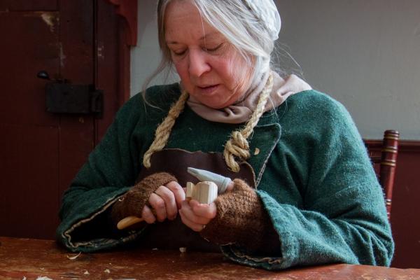 woman carving wood