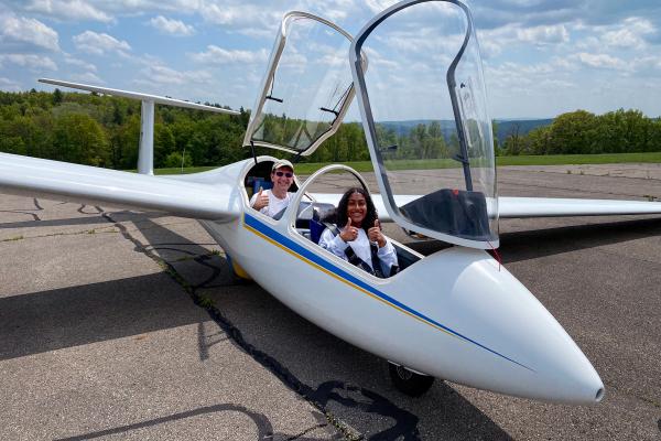 Pilot and young passenger in a glider