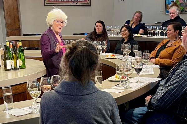Female instructor teaching wine tasting class
