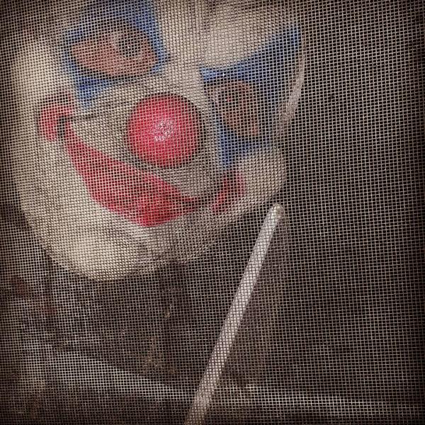 creepy clown looking in the window of Deer Run Winery