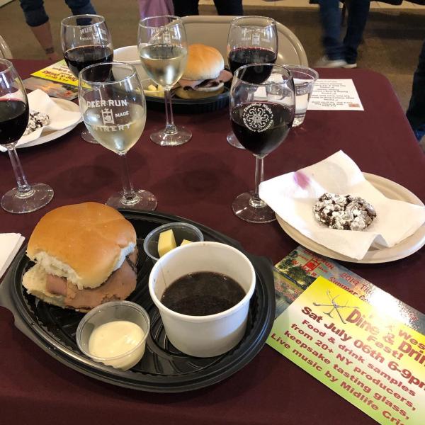 flight of 3 wines with a plate with Red Osier roast beef sandwich, Craig's creamery cheese and a Finger Lakes Cookie Co. cookie