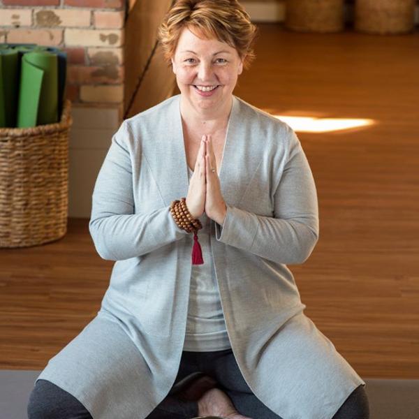 Laura Coburn in yoga pose