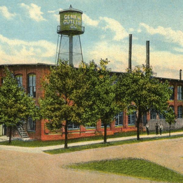 postcard of a multi story brick building