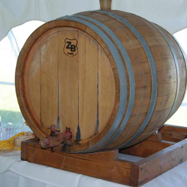 A wooden wine cask filled with Nouveau wine on display at the event