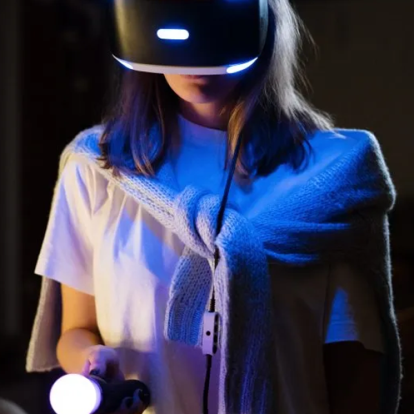 Woman in white t-shirt playing with VR Headset.