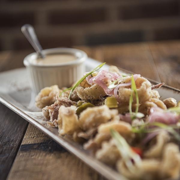 Fried Calamari with pickled peppers, onions, scallions, and spicy aioli