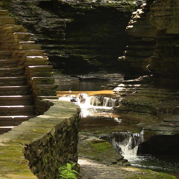 As the stone staircase descends the Gorge Trail, Glen Creek descends the steps of the Glen of Pools.