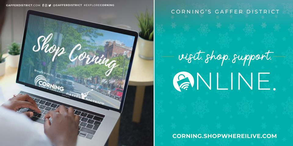 man at laptop with angle of image looking down at laptop and hands, Shop Corning image on laptop screen with teal blue box to right of laptop with white script text 'Shop Corning, Shop Local'